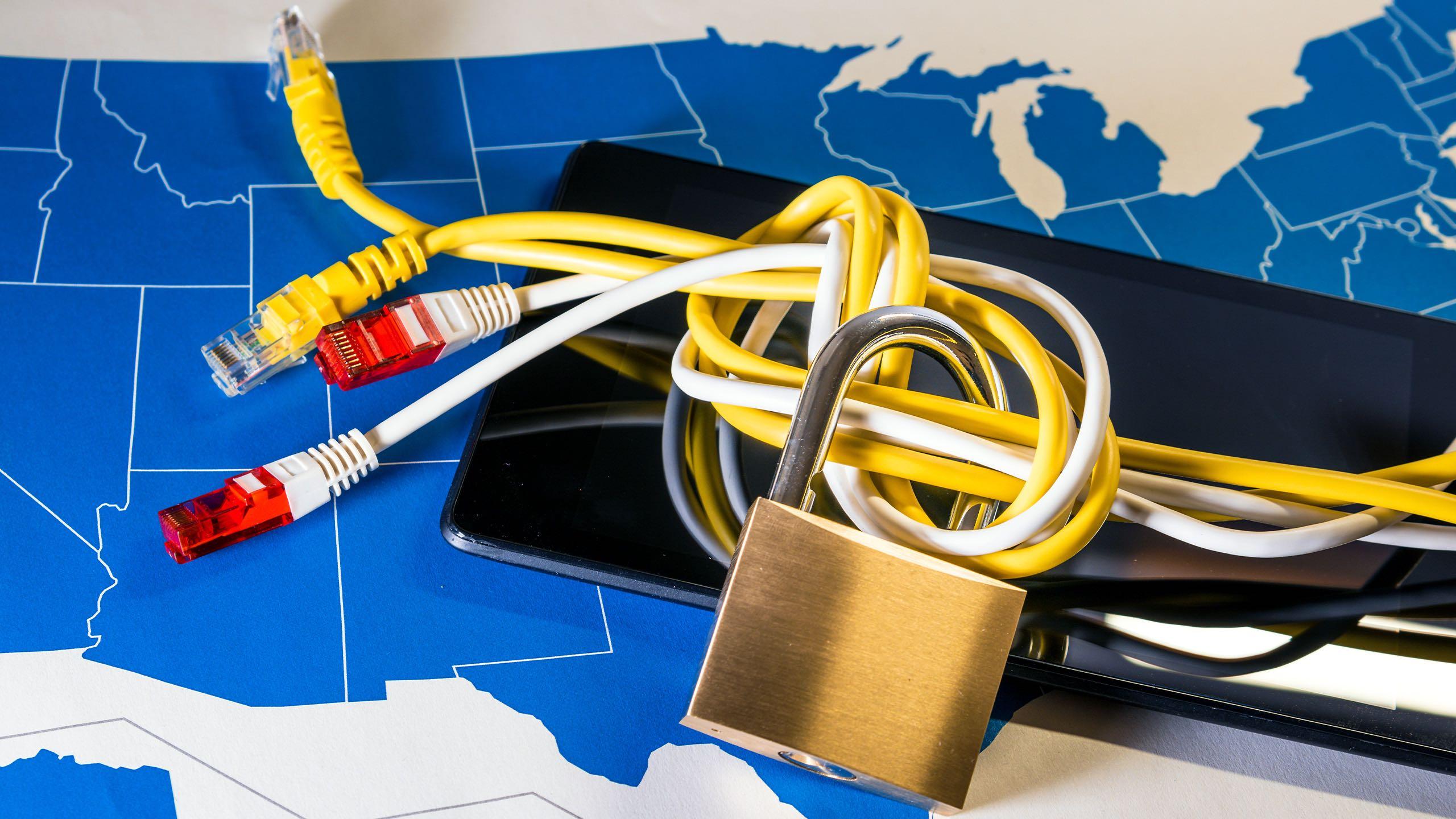 Knotted net cable around a padlock over a US map.