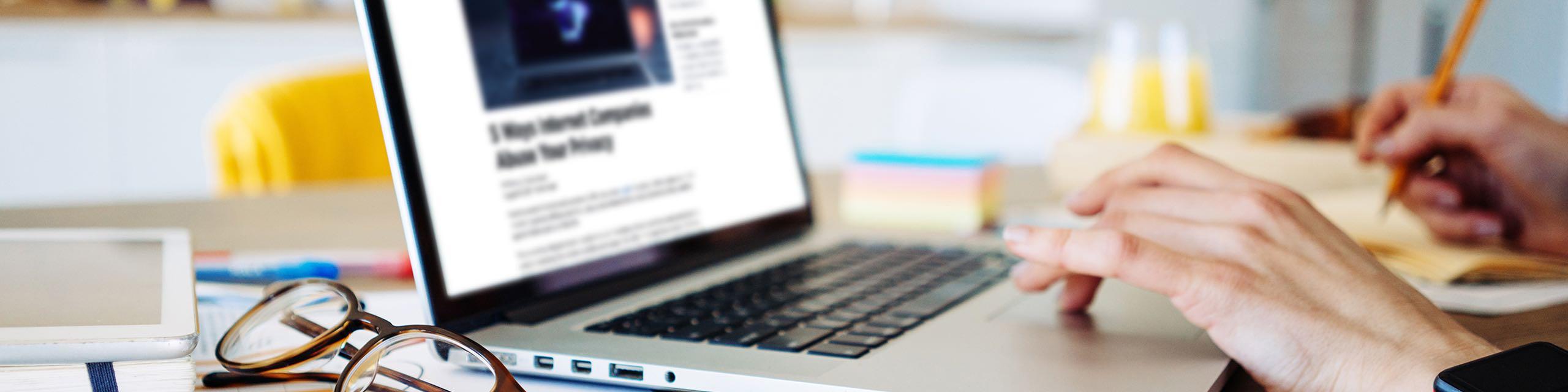 Individual at desk browsing the internet.